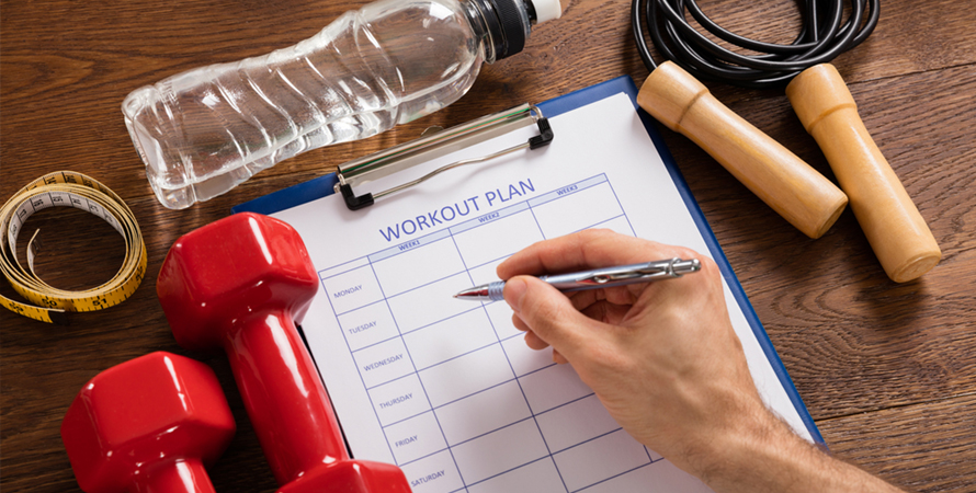 Person filling work out plan