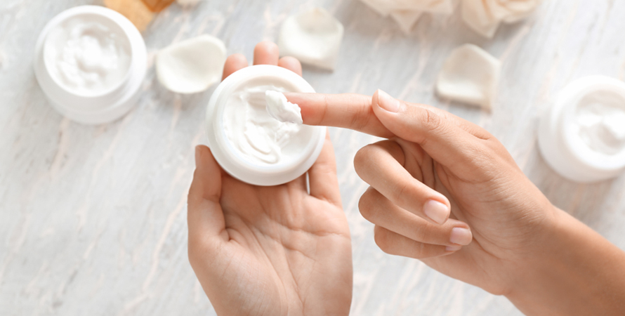 woman applying body cream